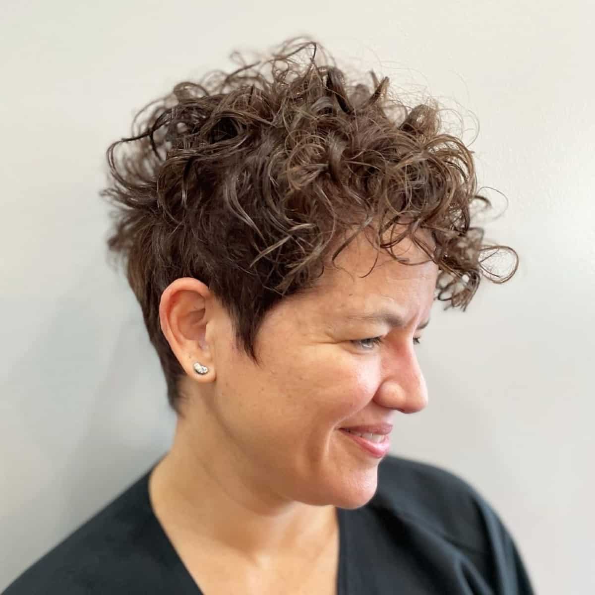 stunning pixie for women over 50, pixie hairdos with curl, women with curly hair, trendy curled hair, trendy hairstyles 2024